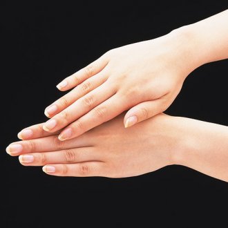 pair of hands on a black background
